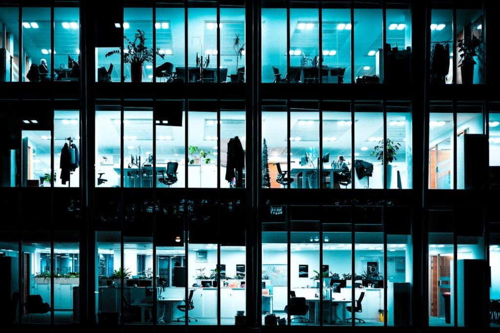 Modern Office Building at Night with Illuminated Windows