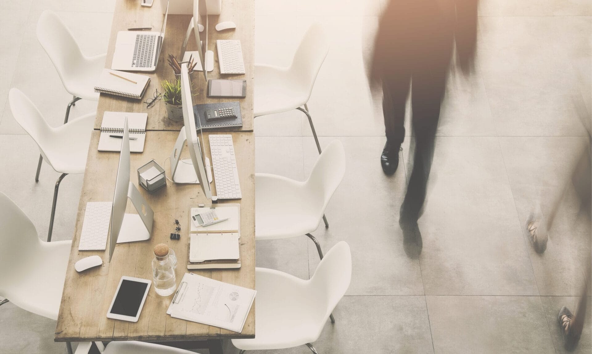Business man passing by table